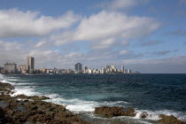 Cuba, Havana, Vedado, Malecon, View across the sea toward the city skyline.