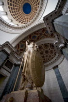 Cuba, Havana, Centro Habana, Capitolo Nacional, Low angle view of the impressive bronze Statue of the Republic just under National Capitol cupola.