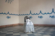 Cuba, Sancti Spiritus, Trinidad, Santeria Yemaya black doll with white dress in Casa Templo de Santeria Yemaya the temple of the Afro Cuban Santeria cult religion.