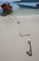 Malaysia, Pulau Perhentian Kecil Coast, Terrengganu,  Anchor with a stretched chain stuck in the sand.
