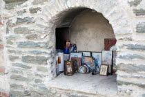 Greece, Macedonia, Thessaloniki, Greek Christian Orthodox religious icons inside a small iconostasis within Moni Vlatadon monastery stone walls