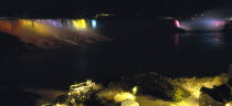 Canada, Ontario, Niagara Falls, Both American and Horseshoe falls illuminted at night.