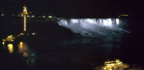 Canada, Ontario, Niagara Falls, American falls illuminted at night.