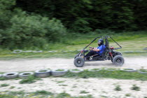 Sport, Motor Racing, Buggy Race, Caged buggy car racing around dirt track.