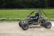 Sport, Motor Racing, Buggy Race, Caged buggy car racing around dirt track.