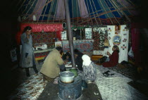 Mongolia, Kazakh family inside their yurt