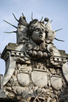 Poland, Krakow, Head of Apollo on top of the entrance to the Palace of Arts built in 1901 for the Society of Fine Arts Friends.