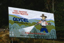 Sri Lanka, Nuwara Eliya, Hand painted billboard poster advertising Glycel weed killer fertiliser from Anglo Asian Fertilisers containing Glyphosate a systemic herbicide originally patented by Monsanto...