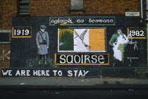 Ireland, North, Belfast, Irish Republican mural on the side of a terrace house on the corner with Falls Road commemorating the Easter Rising of 1919.