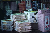 Japan, Honshu, Tokyo, Bento boxes of packed prepared meals on display at a food kiosk on Tokyo railway station platform.
