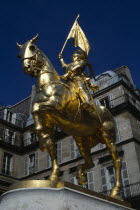 France, Ile de France, Paris, Gilded golden bronze statue of Joan of Arc on horseback in armour carrying her standard by Fremiet in Place des Pyramids in the Tuileries Quarter a focus of pilgrimage fo...