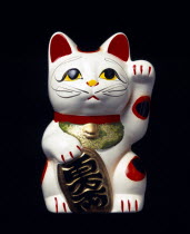 Japan, Honshu, Kyoto, Traditional statue of Maneki Neko Beckoning Cat associated with good luck and wealth also known as Welcoming Cat or Money Cat or Inviting Cat or Money cat or Fortune Cat or Lucky...