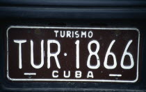 Cuba, Habana, Havana, Brown Turismo tourist car hire registration number plate.