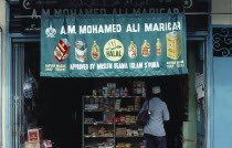 Brunei, Bandar Seri Begawan, Approved Muslim Halal sign on banner hanging over entrance to grocery shop in the capital city.
