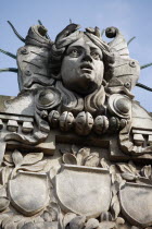Poland, Krakow, Head of Apollo on top of the entrance to the Palace of Arts built in 1901 for the Society of Fine Arts Friends.