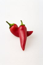 Food, Vegetables, Chillies, Two hot red chilli peppers on a white background.