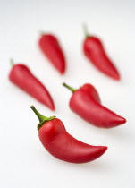 Food, Vegetables, Chillies, Five hot red chilli peppers on a white background.