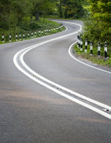 Transport, Roads, Country, A283 Washington Road single carriageway road with double white lines in the centre bending around a corner.