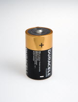 Power, Electricity, Batteries, 1.5 volt Duracell Alkaline battery showing positive and negative terminals on a white background.