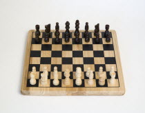 Toys, Games, Board Games, Chess board with pieces laid out for start of game against a white background.