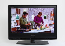 Communications, Media, Television, Sony Bravia Wide Flat Screen TV on a white background showing a cookery programme with presenter and guest chef preparing food.