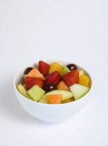 Food, Fruit, Salad, White bowl of fresh fruit salad on a white background.