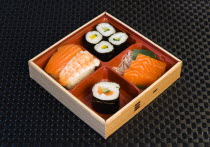 Food, Meal, Sushi, Bamboo box with sushi rice wrapped in seaweed and seafood and fish selection.