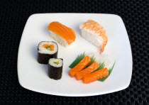 Food; Sushi; Meal; Sushi plate with rice wrapped in seaweed and seafood and fish selection.