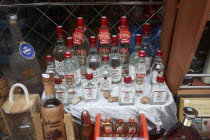 Poland, Krakow, display of vodka in shop front.