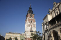 Poland, Krakow, Old Town Hall in the Rynek Glowny market square with part of the Cloth Hall to the right.