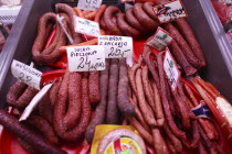 Poland, Krakow, display of cold meats in Stary Kleparz market.