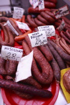 Poland, Krakow, display of cold meats in Stary Kleparz market.