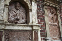 Poland, Krakow, bas reliefs of Georgius Laubacensis & Anna Petri on the outside of St Barbara's church.