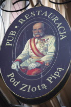 Poland, Krakow, Bar or restaurant sign for Pod Zlota Pipa in the old city.