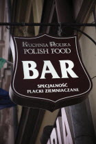 Poland, Krakow, bar sign for Polish food in the old city.