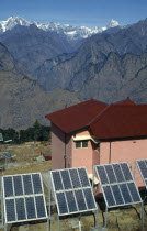 Nepal, Solar Panels for pink Hotel standing in the Himalayan landscape in Anli.