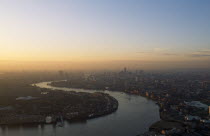 England, London, Canary Wharf, View over the City of London from Canada Tower in a  haze of smog at dawn.