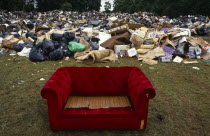 Environment, Litter, Red sofa surrounded by a mountain of other rubbish dumped in a public park during a council workers strike in Liverpool. 