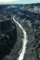 USA, New Mexico, Rio Grande River, View along river near Taos showing deeply eroded banks and bed. 
