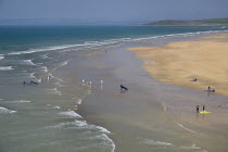 Ireland, County Donegal, Bundoran, Tullan Strand beach with surfers.