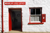 Ireland, County Tyrone, Omagh, Ulster American Folk Park, Mountjoy Post Office with Victorian letterbox.