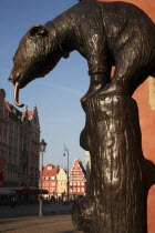 Poland, Wroclaw, replica of E. M. Geygers fountain with bronze cast bear, superstitious tourists touch the nose for good luck.