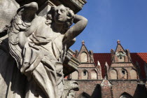 Poland, Wroclaw, Ostrow Tumski, detail of figure at base of baroque monument to the Catholic Martyr John Nepomuk, made in sandstone by Johann Georg Urbansky in 1732 in front of the Church of the Holy...