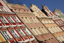 Poland, Wroclaw, pastel coloured building facades in the Rynek old town square.