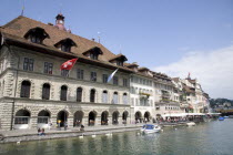 Switzerland, Lucerne, View along waterfront buildings toward thge Chapel Bridge.