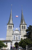 Switzerland, Lucerne, St Leodegar Church exterior with tourists.