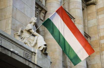 Hungary, Pest County, Budapest, Hungarian flag flying from building facade.
