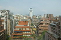 Chile, Santiago, Multistorey apartment blocks with wide balconies and greenery in the upmarket neighbourhood of Vitacura.