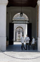 Chile, Santiago, Main entrance of the Palacio de la Moneda Presidential Palace guarded by high booted carabineros police, a chain prevents tourists and onlookers from getting too close.