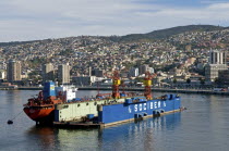 Chile, Valparaiso, Floating dry dock at the once again busy port now a UNESCO World Heritage city.